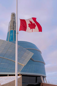 Low angle view of flag against building