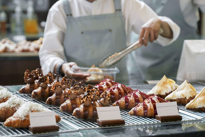 High angle view of person preparing food on barbecue grill