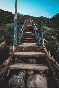 Old wooden staircase against sky