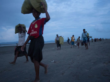 People walking on beach