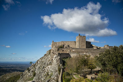 Low angle view of fort against sky