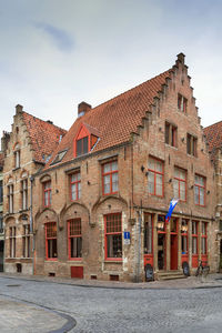 Street with historical houses in bruges historic center, belgium
