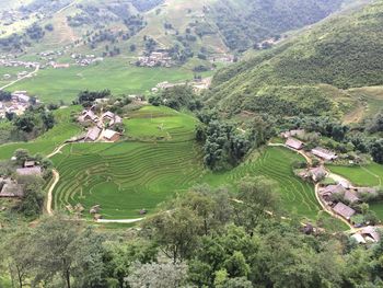 Scenic view of landscape by mountain