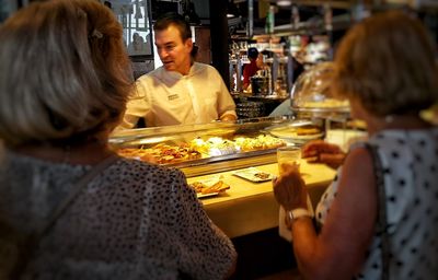 Man eating food in restaurant