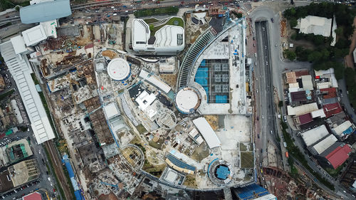 High angle view of buildings by street in city