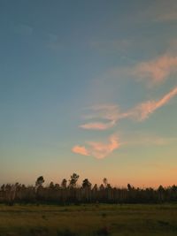 Scenic view of field against sky during sunset