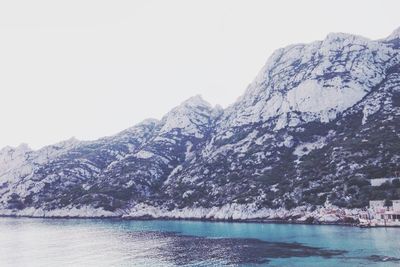 Scenic view of lake with mountains in background