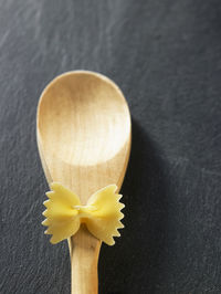 Directly above shot of farfalle pasta on spoon