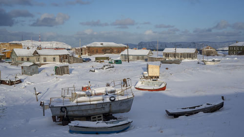 Panoramic view of buildings against sky during winter