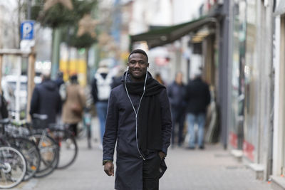 Man standing on city street