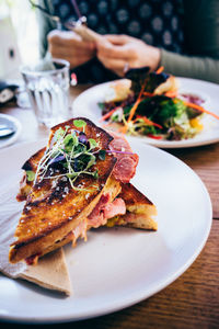 High angle view of grilled sandwich in plate on table