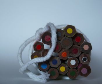 Close-up of paper over table against white background