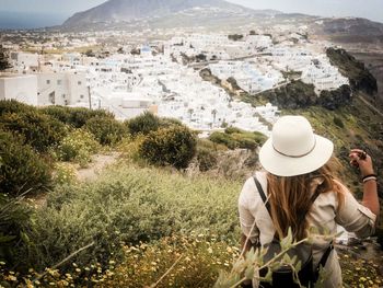 Rear view of woman looking at town square