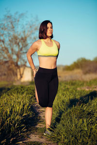 Full length of woman standing on field