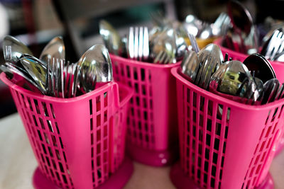 Stainless steel cutleries in a plastic container in an asian restaurant