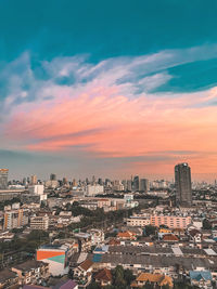 High angle view of townscape against dramatic sky