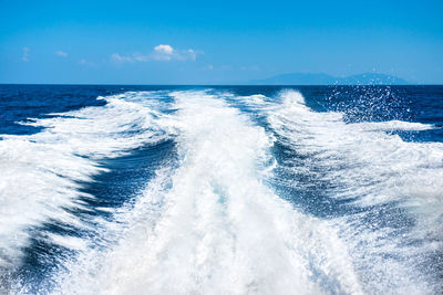 Scenic view of sea against blue sky