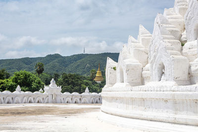 View of temple against cloudy sky