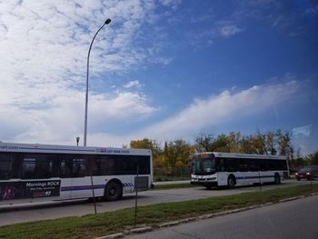 Car on street against sky