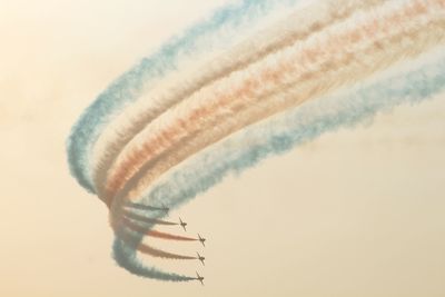 Tilt image of airplane flying against clear sky