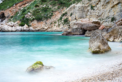 Scenic view of rock formation in sea