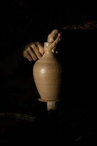 Close-up of illuminated electric lamp against black background