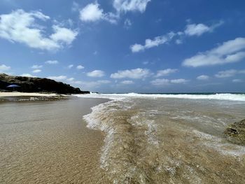 Scenic view of beach against sky