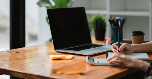 Man using laptop on table
