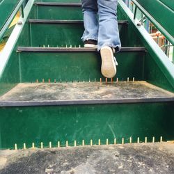 Low section of man standing on water