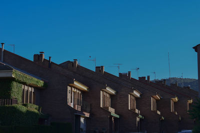 View of city against clear blue sky