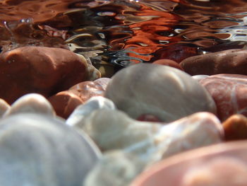 Full frame shot of pebbles in water