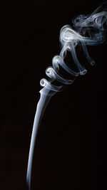 Close-up of light painting against black background