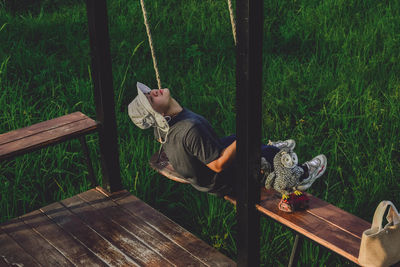 Woman sitting on wood