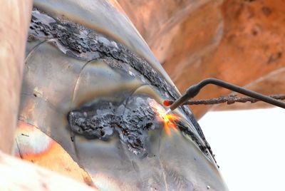 Welding at bronze statue