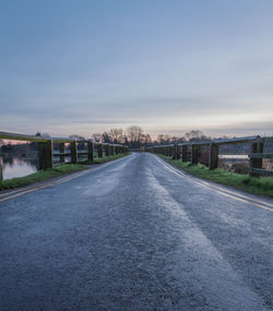 Road in city against clear sky