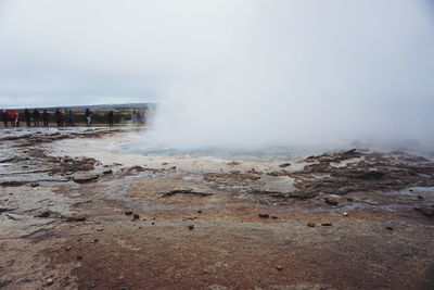 Scenic view of geyser strokkur iceland against sky