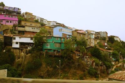 Houses in city against clear sky