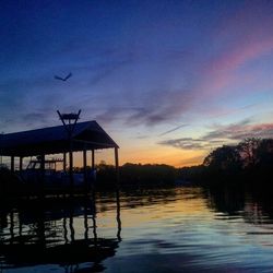 Scenic view of lake at sunset