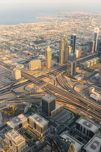 High angle view of modern buildings in city against sky