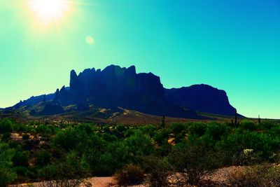 Scenic view of mountains against clear blue sky