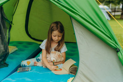 Portrait of young woman in tent