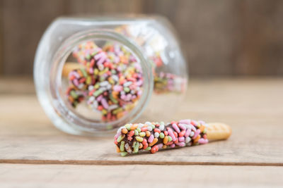 Close-up of chopped fruits in glass on table