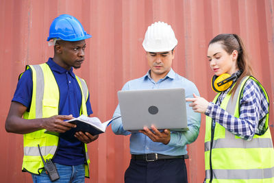 Full length of man working on laptop