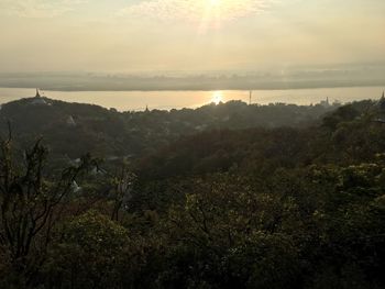 Scenic view of landscape against sky during sunset