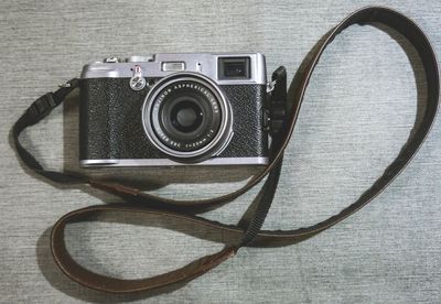 Close-up of camera on table