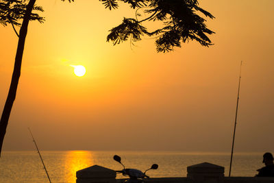 Scenic view of sea against sky at sunset