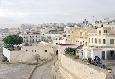 High angle view of buildings in city against sky