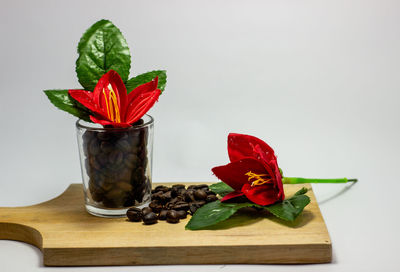 Close-up of red rose on table