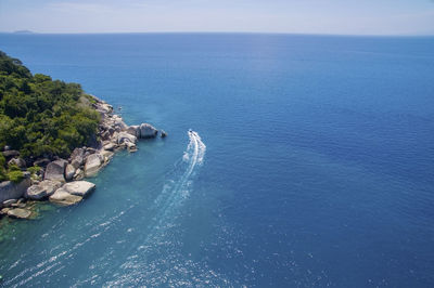 Scenic view of sea against blue sky