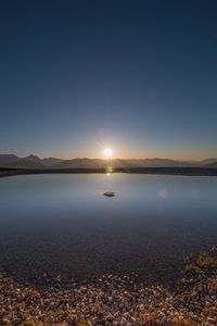 Scenic view of sunset over calm sea